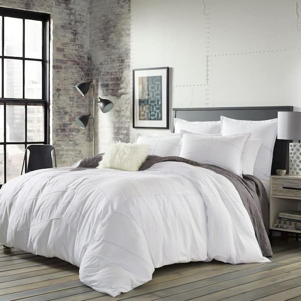 white comforter grey sheets