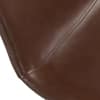 Close-up texture of the brown faux leather seat.