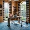 Large wooden executive desk setup in a room.