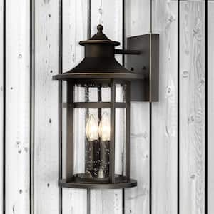 Highland Ridge Collection 4-Light Oil Rubbed Bronze with Gold Highlights Outdoor Wall Lantern Sconce