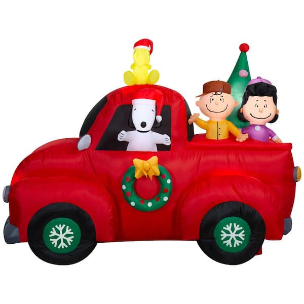 5.9 ft. Tall 8 ft. Wide Snoopy Driving Truck with Friends Christmas Inflatable