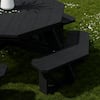 Black octagon picnic table set up outdoors on grass.
