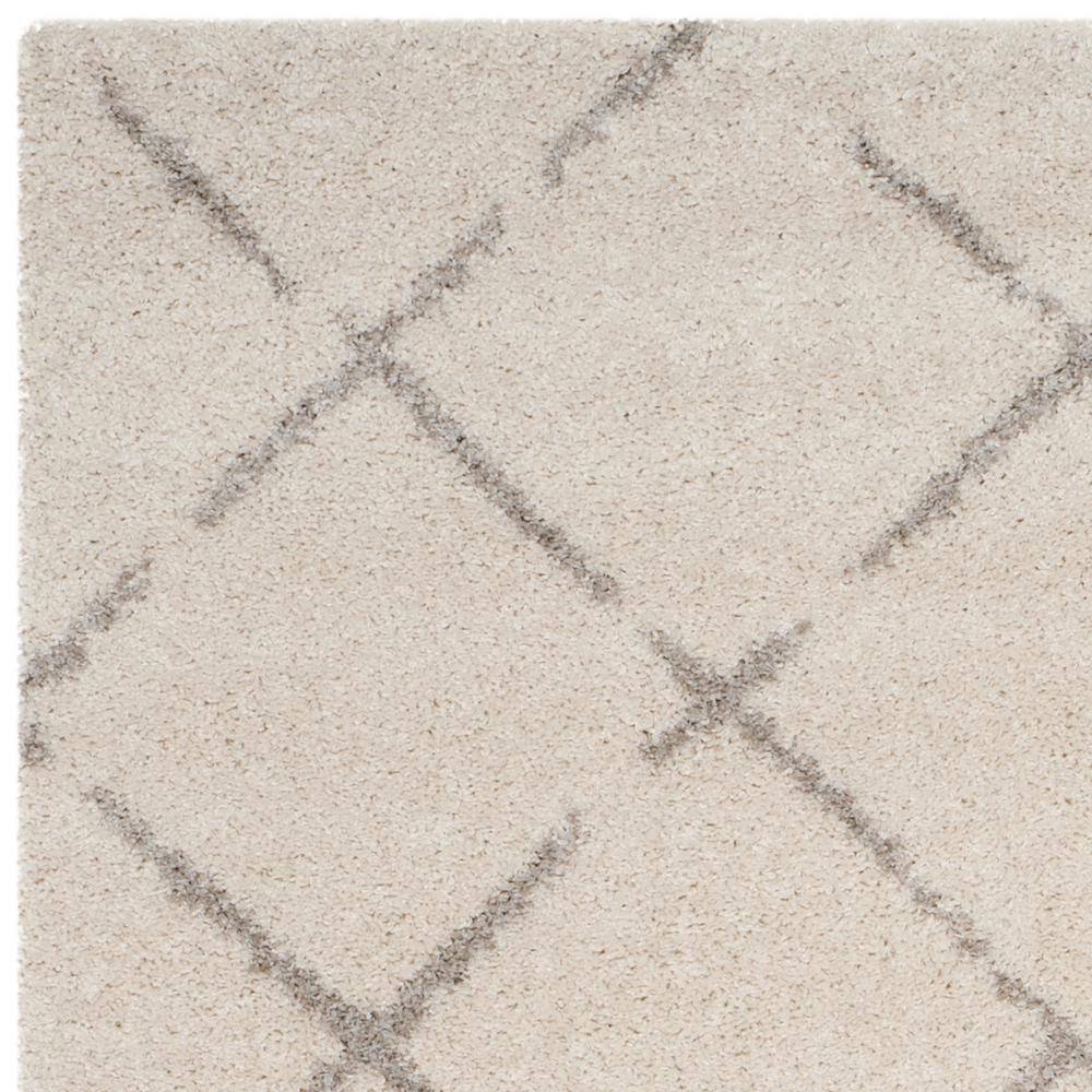 Ivory and Beige Geometric Shag 8' x 10' Area Rug