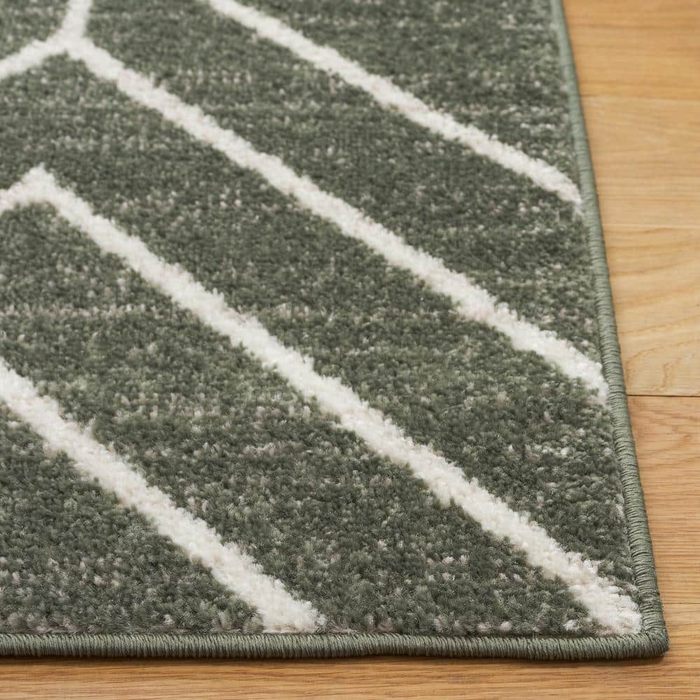 Ivory and Dark Green Geometric Synthetic Area Rug 5'1" x 7'6"