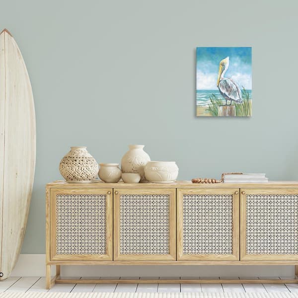 Pelican Perched near Shore by Diane Kater Unframed Animal Graphic Art Print 20 in. x 16 in.