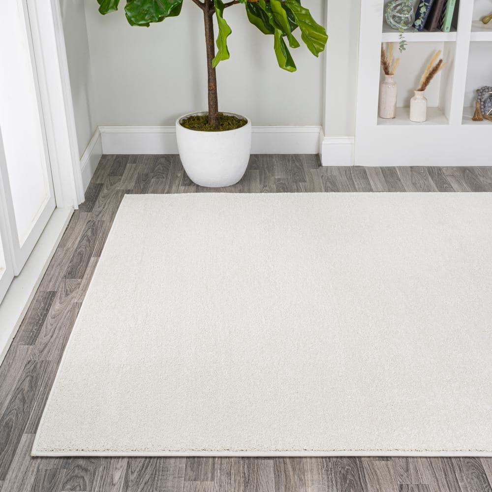 Cream Solid Synthetic Reversible 10' x 14' Area Rug