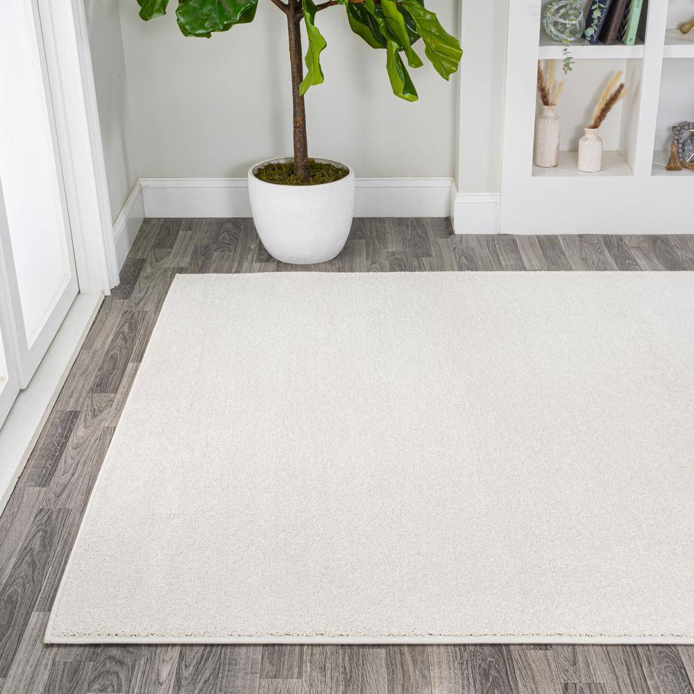 Cream Synthetic Low-Pile Reversible Indoor Area Rug