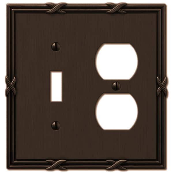 AMERELLE Ribbon and Reed 2 Gang 1-Toggle and 1-Duplex Metal Wall Plate - Aged Bronze