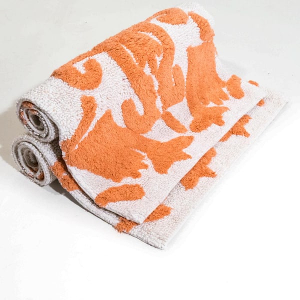 https://images.thdstatic.com/productImages/512ff153-8d8e-4603-a088-d79497f8e299/svn/white-and-coral-chesapeake-merchandising-bathroom-rugs-bath-mats-37314-4f_600.jpg