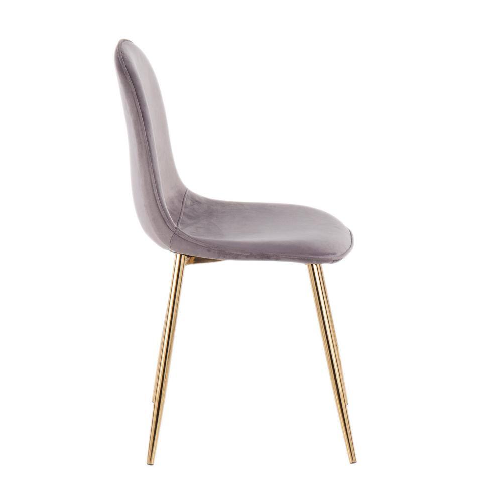 Side view of a pebble grey velvet dining chair with gold metal legs.