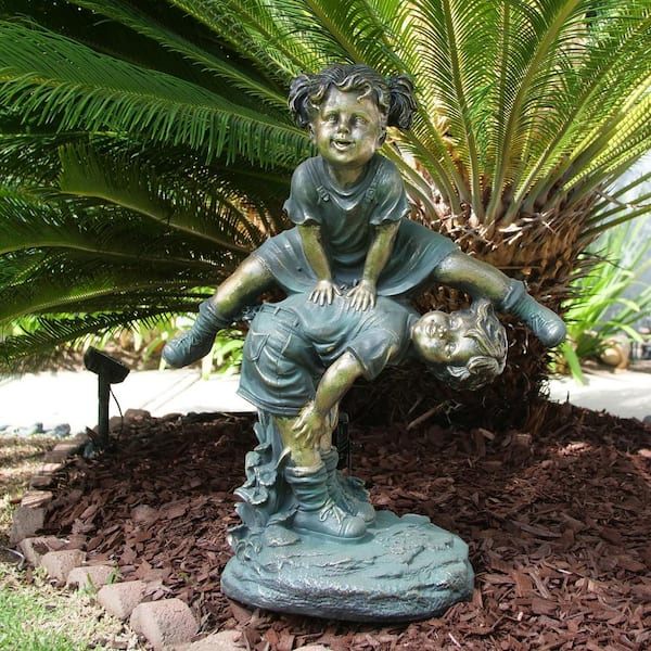 26 in. Tall Indoor/Outdoor Girl Jumping Over Boy Statue Yard Art Decoration