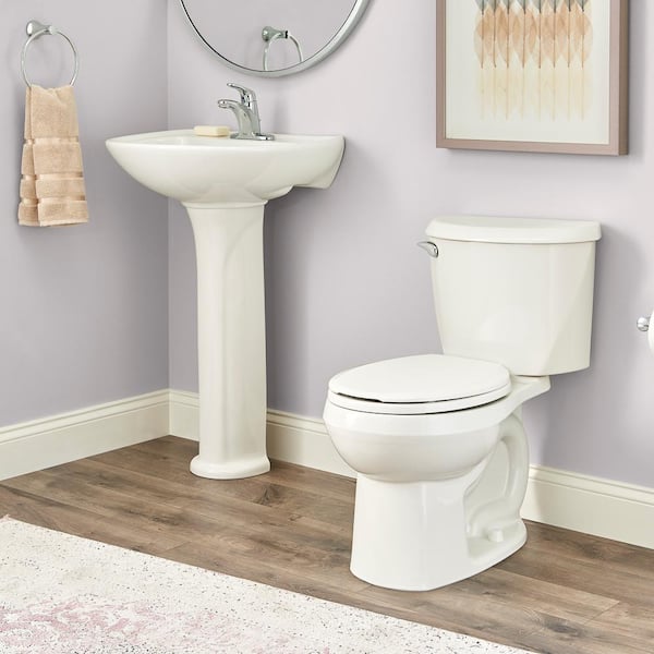 Reliant Two-Piece 1.28 GPF Single Flush Round Standard Height Toilet with Slow-Close Seat in White