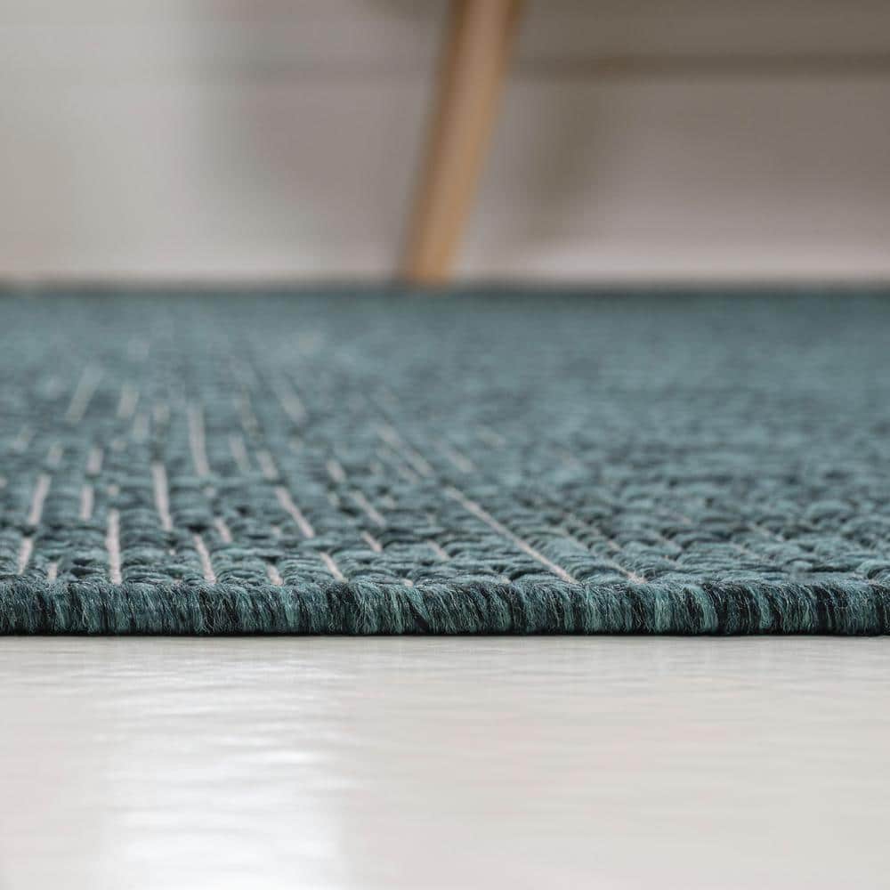 Turquoise and Cream 4' x 6' Solid Synthetic Area Rug