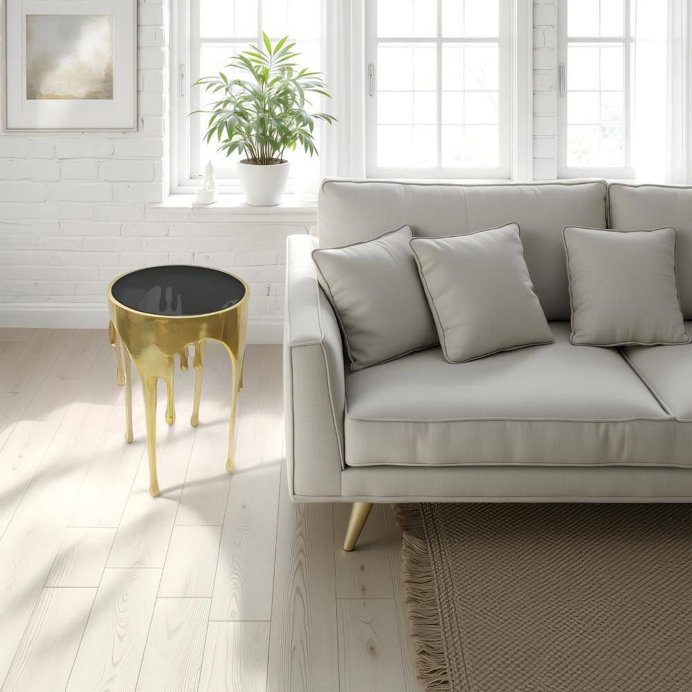 Capri 15.5 in. Antique Gold Brass and Black Round Glass Top End Table with Melting Drip Design