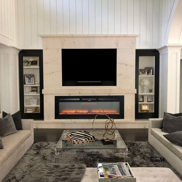 Sitting room with marble fireplace, pair of black leather button