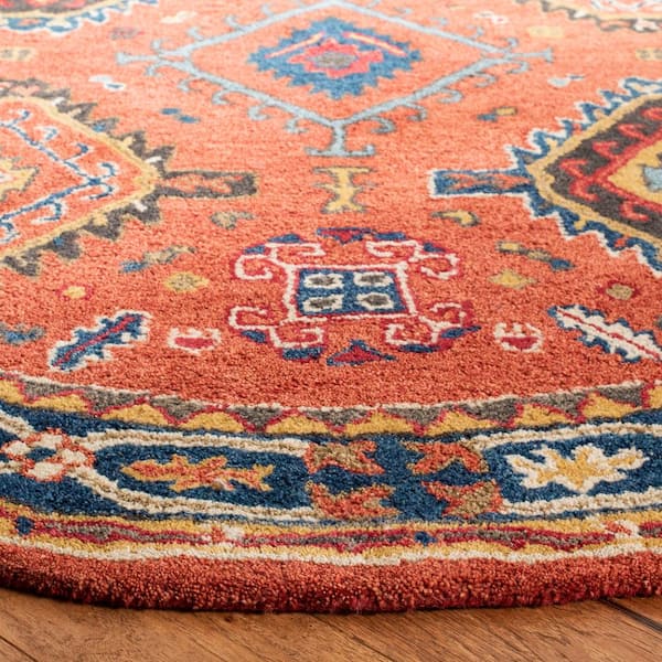https://images.thdstatic.com/productImages/520d581a-5cc1-4ce4-8530-8d755ad35a41/svn/rust-navy-safavieh-area-rugs-hg427p-6r-c3_600.jpg