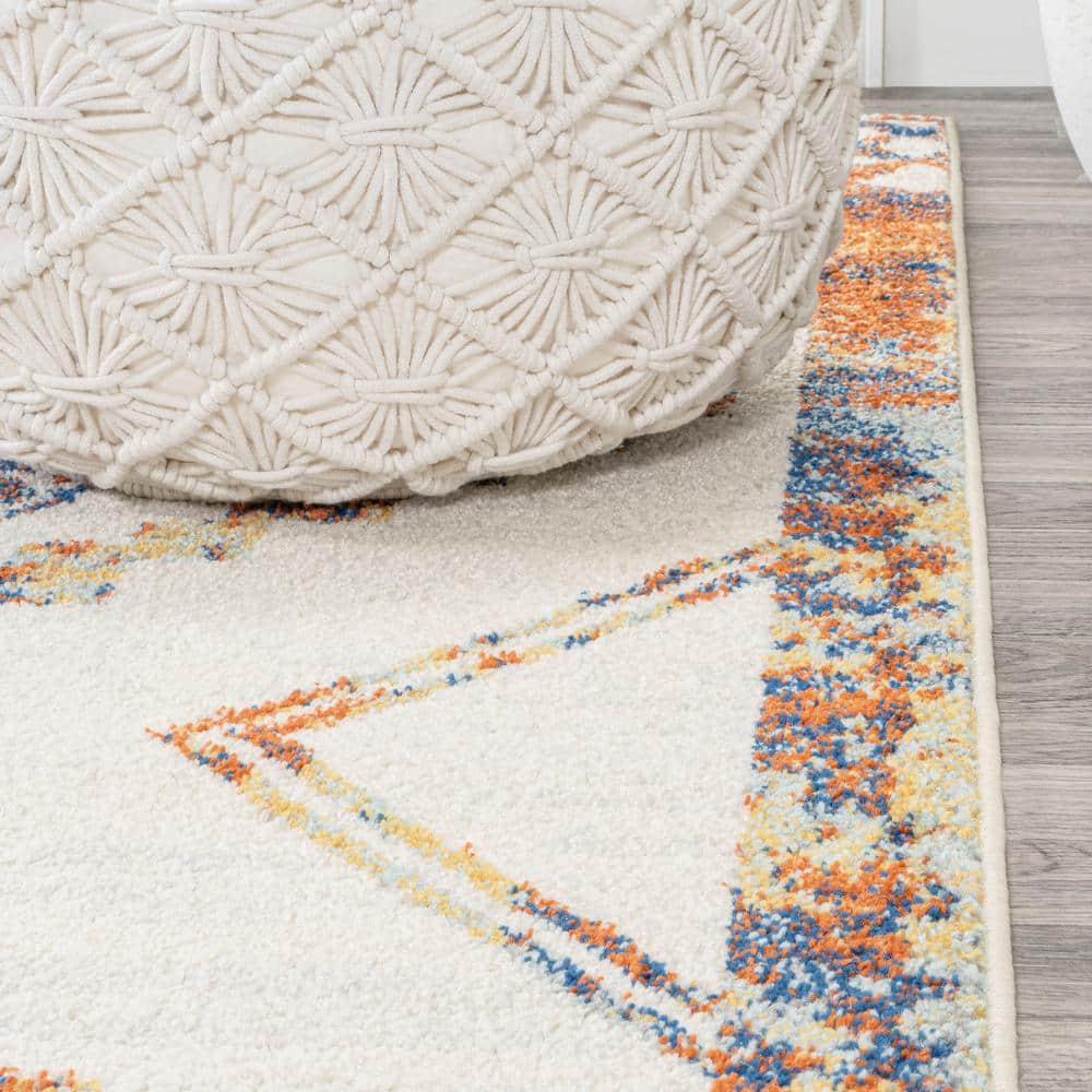 Ivory and Blue Geometric 8' x 10' Synthetic Area Rug