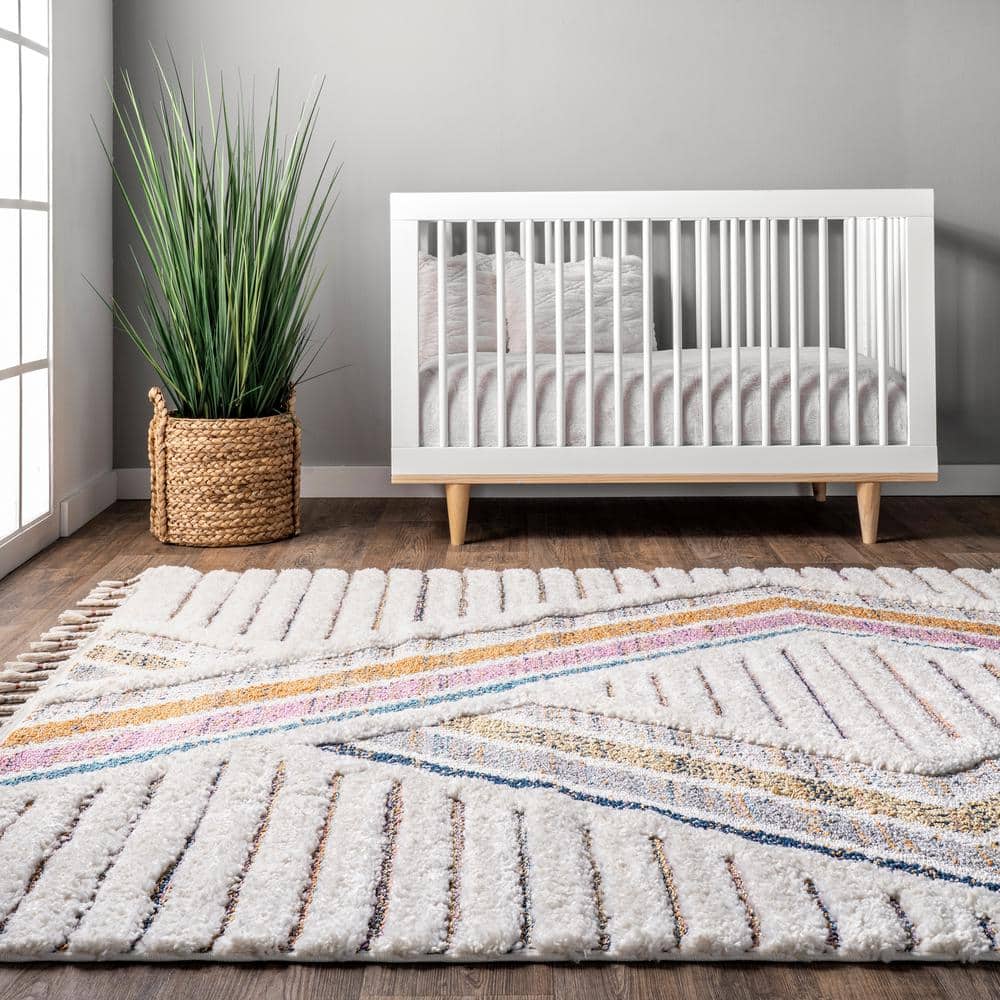 Ivory Geometric Synthetic Rectangular Area Rug with Braided Tassels