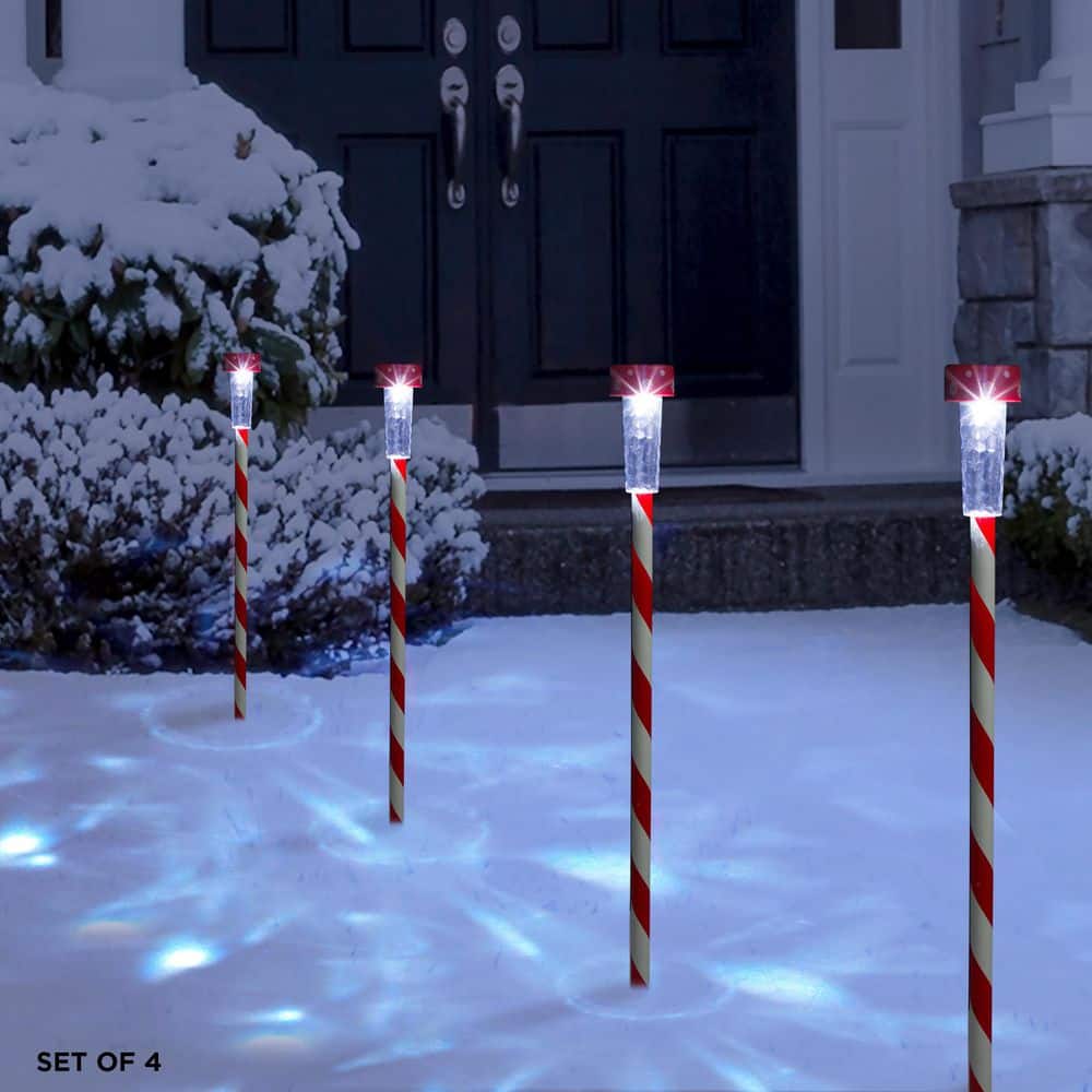 Alpine Corporation 27" Striped Plastic Solar Light-Up Holiday Garden Stakes, Set of 4, Red/White