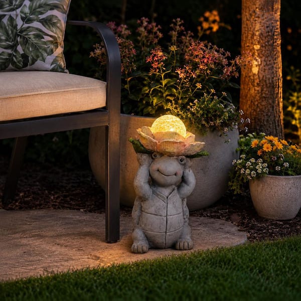 Liv & Skye Gray 15 in. Ceramic Turtle Holding Large Solar Flower