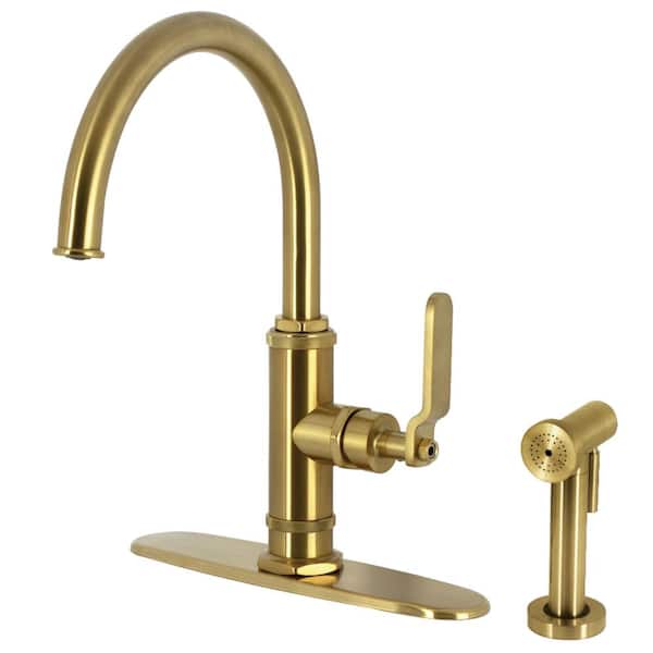 Kingston Brass Whitaker Deck Mount Single Handle Standard Kitchen Faucet with Sprayer in Brushed Brass
