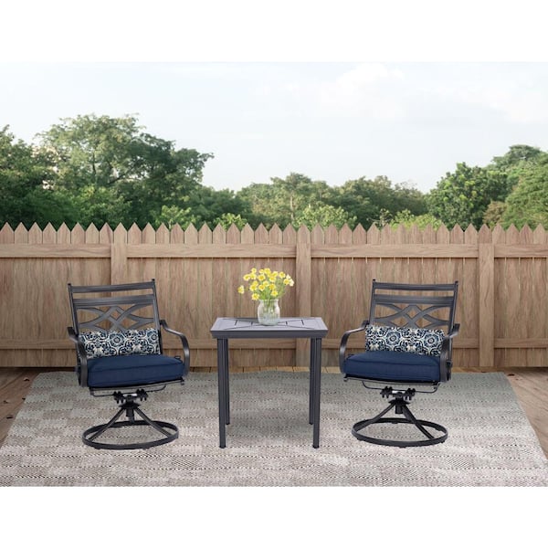 Hanover Montclair 3-Piece Steel Outdoor Bistro Set with Navy Blue Cushions, 2 Swivel Rockers and 27 in. Table
