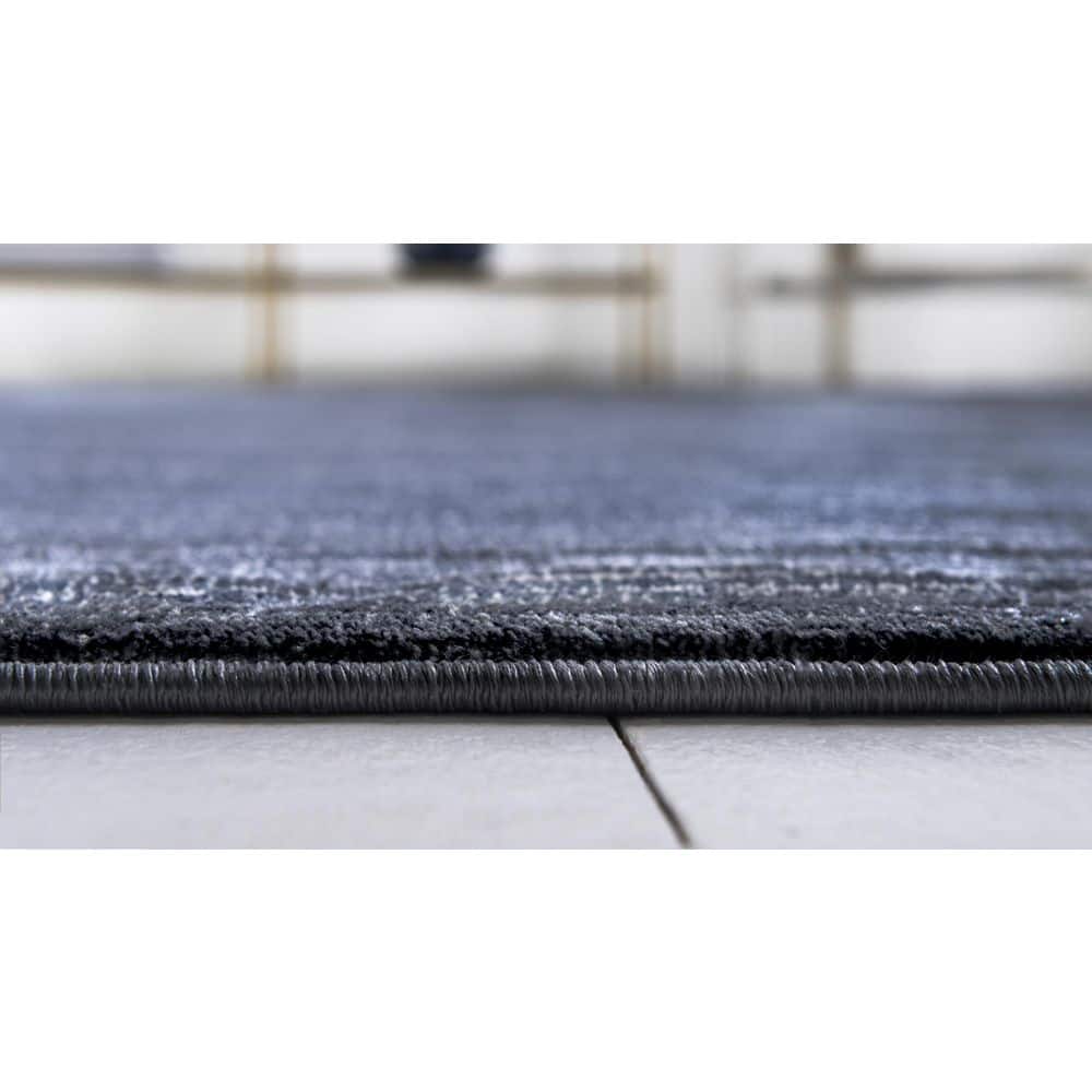 Navy Blue and Ivory 9' x 12' Easy-Care Synthetic Area Rug