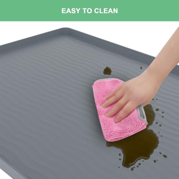 This Under-Sink Mat on  Makes Cleaning Under the Sink Easy