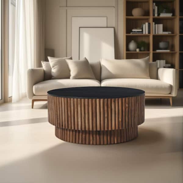 THE URBAN PORT Montoya 34 in. Brown and Black Round Mango Wood Coffee Table with Fluted Plinth Base