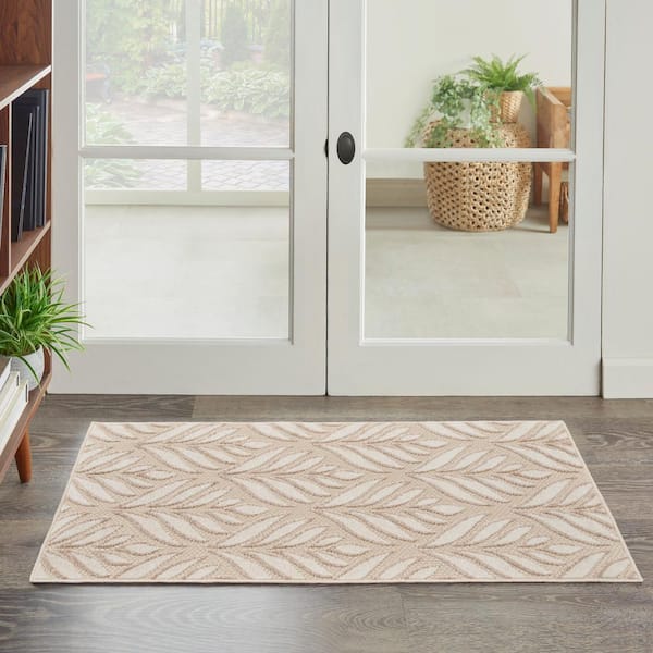 https://images.thdstatic.com/productImages/52d776bd-8624-5e2e-981f-cae10f499a21/svn/ivory-grey-nourison-outdoor-rugs-175052-e1_600.jpg