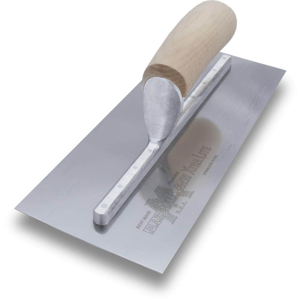 Metal spatula, trowel with plastic handle and paint brush on white