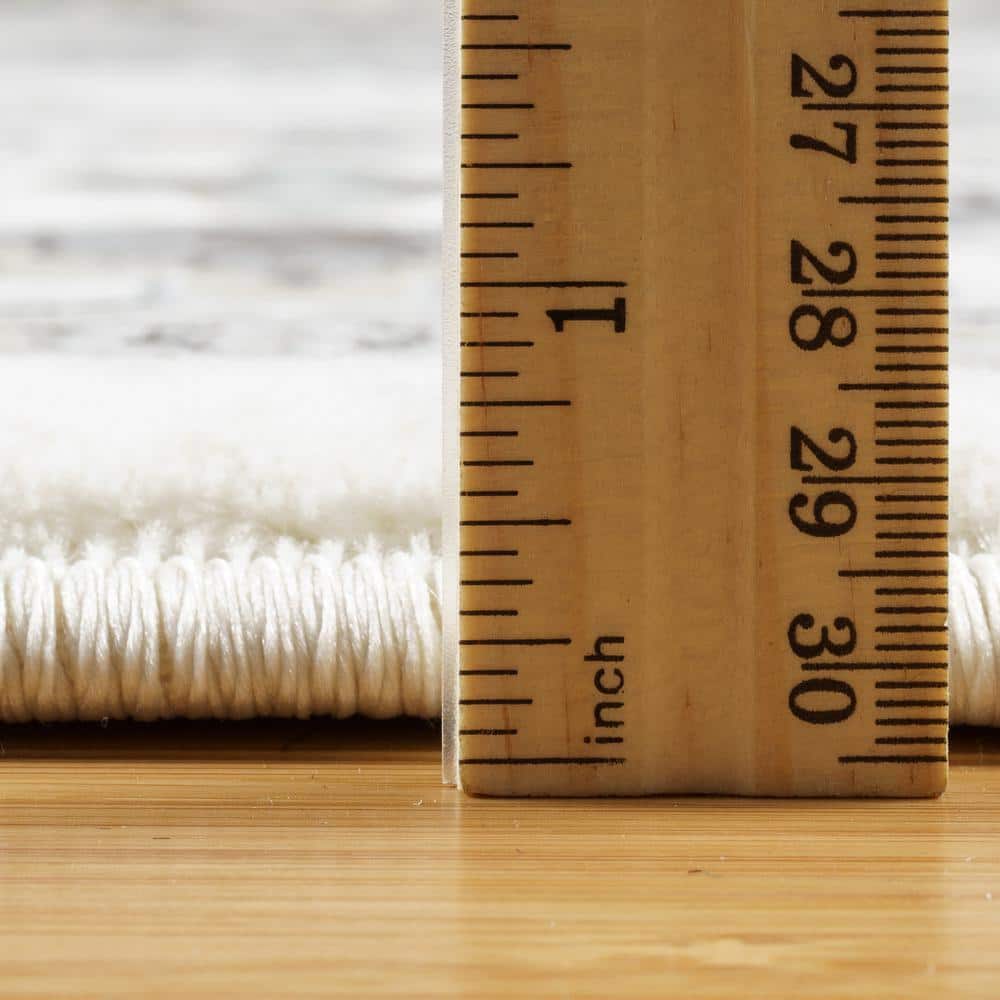 Ivory and Gray Tufted Synthetic 6' x 9' Area Rug