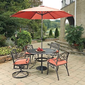 Sanibel Rust Bronze 7-Piece Cast Aluminium Round Outdoor Dining Set with Coral Cushions and Umbrella