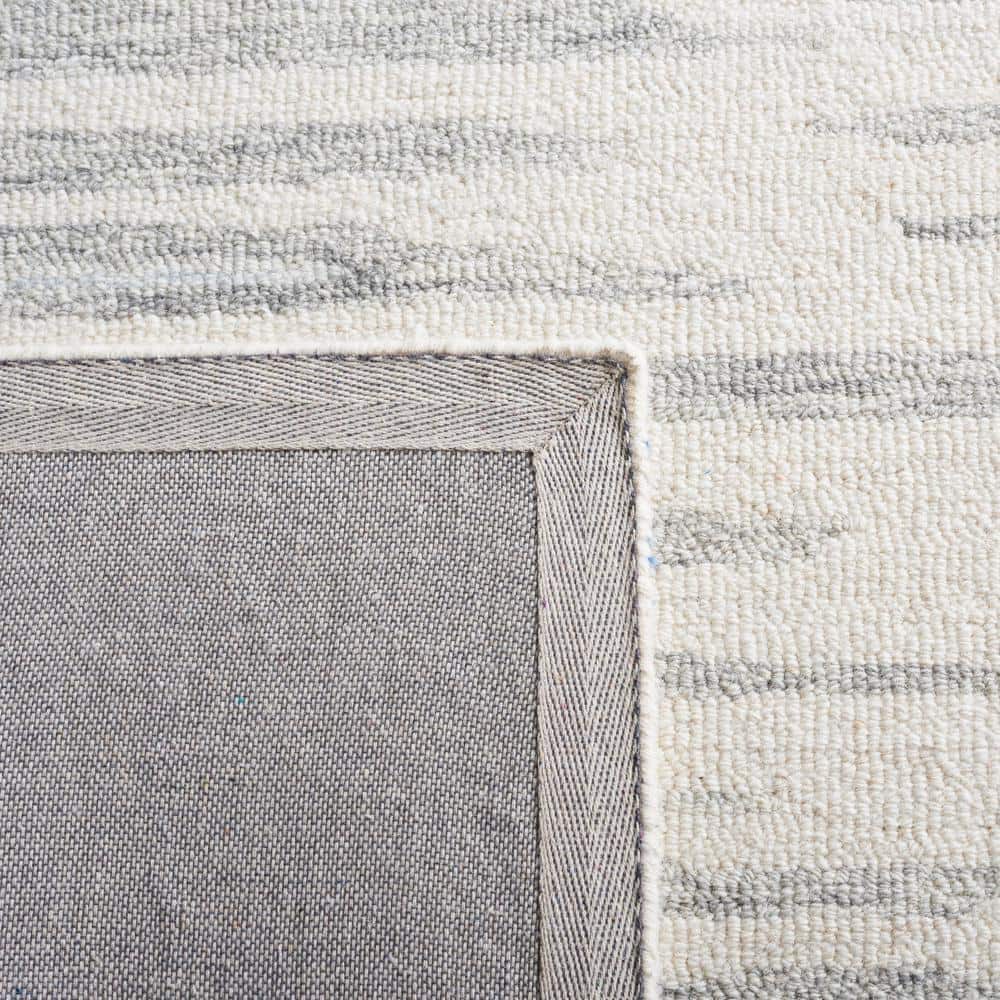 Handmade Abstract Ivory and Light Blue Wool Area Rug, 4' x 6'
