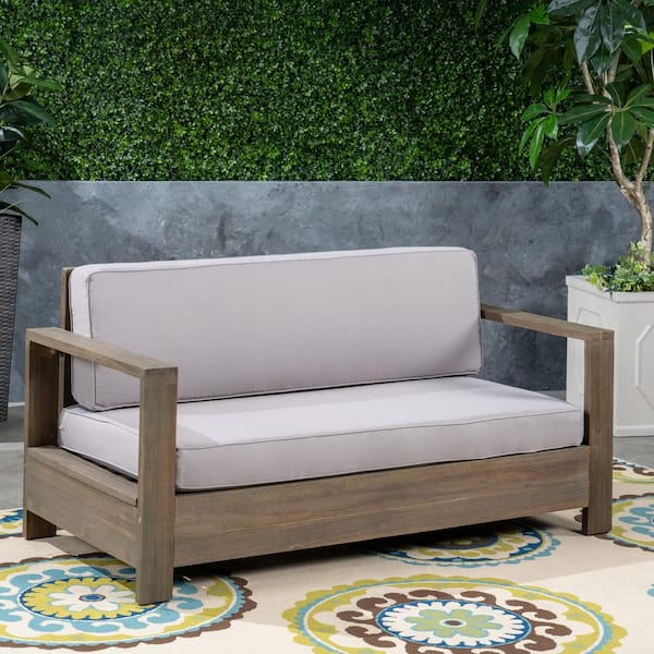 Noble House Devon Brushed Grey Wood Outdoor Loveseat with Light Grey Cushion