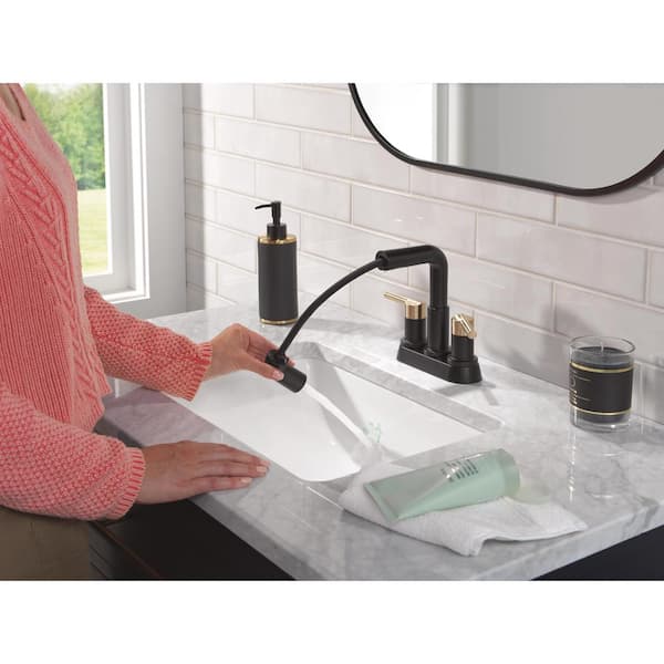 Nicoli 4 in. Centerset Double Handle Pull-Down Spout Bathroom Faucet in Matte Black / Champagne Bronze