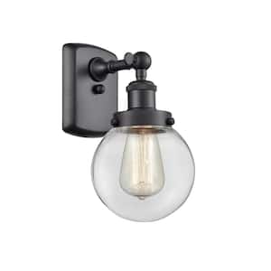 Beacon 1-Light Matte Black Wall Sconce with Clear Glass Shade