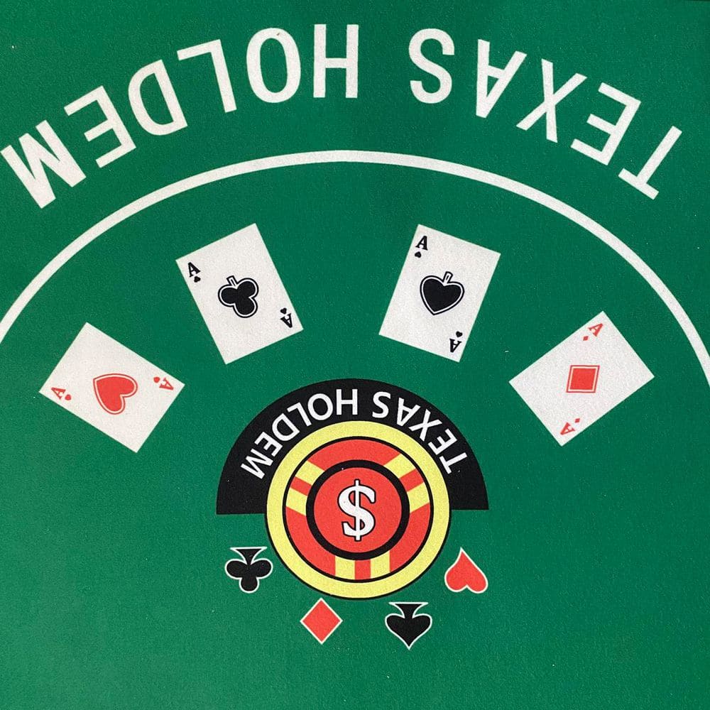 Close-up of the green felt poker table surface with Texas Holdem graphics.