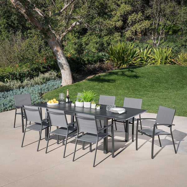 Cambridge Turner 9-Piece Aluminum Outdoor Dining Set with 8-Sling Dining Chairs and 40 in. x 94 in. Table