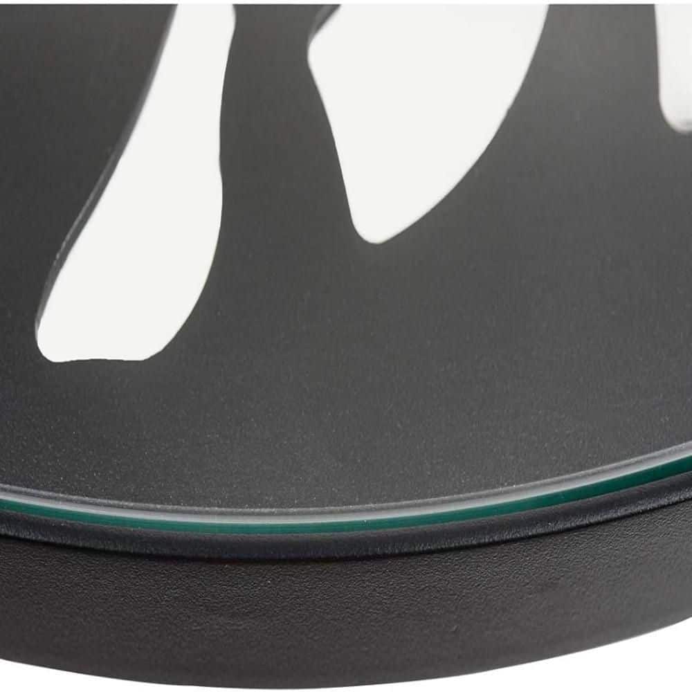 Close-up detail of the black table edge and glass top.
