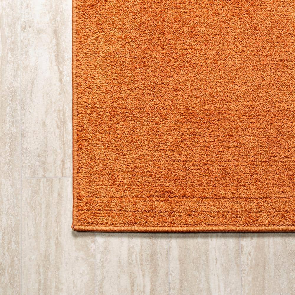 Haze Solid Orange 5'3" Square Synthetic Area Rug