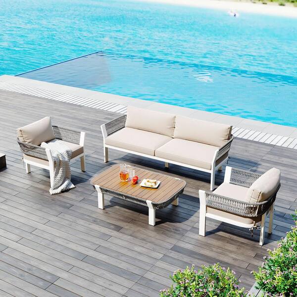 Zeus & Ruta Gray 4-Piece Woven Rope Sling Patio Conversation Set with Coffee Table and Beige Cushions for Poolside, Lawn and Garden