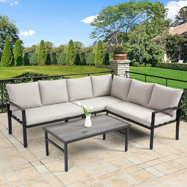 Boosicavelly 4-Piece Wicker Patio Conversation Set with Water Resistant Beige Thick Cushions and Coffee Table