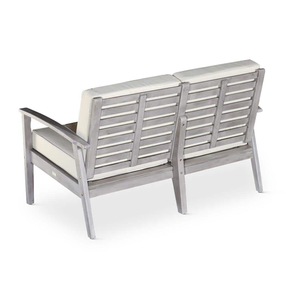 Rear view of the silver gray wood outdoor dining bench.