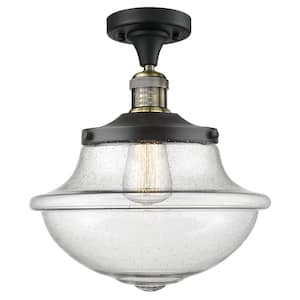 Franklin Restoration Small Oxford 11.75 in. 1-Light Black Antique Brass Semi-Flush Mount with Seedy Glass Shade