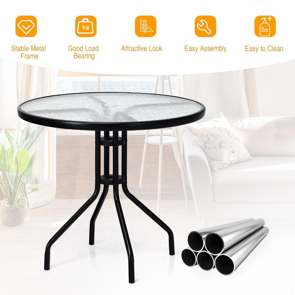 Round glass and steel patio dining table on white background.