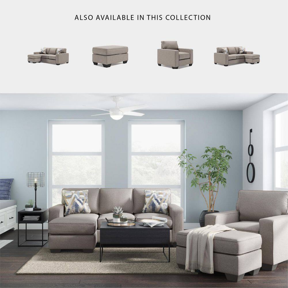 Lifestyle image showing the gray ottoman as part of a living room set with matching sofas and chairs.