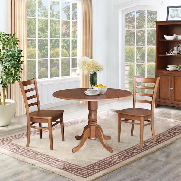 Round dining table with a 2024 leaf