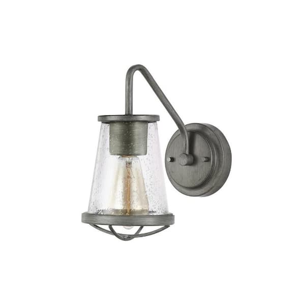 Georgina 5.75 in. 1-Light Weathered Iron Industrial Wall Sconce with Clear Seeded Glass Shade and Cage Accent
