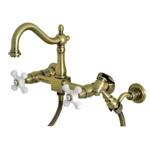 Heritage 2-Handle Wall Mount Kitchen Faucets with Brass Sprayer in Antique Brass